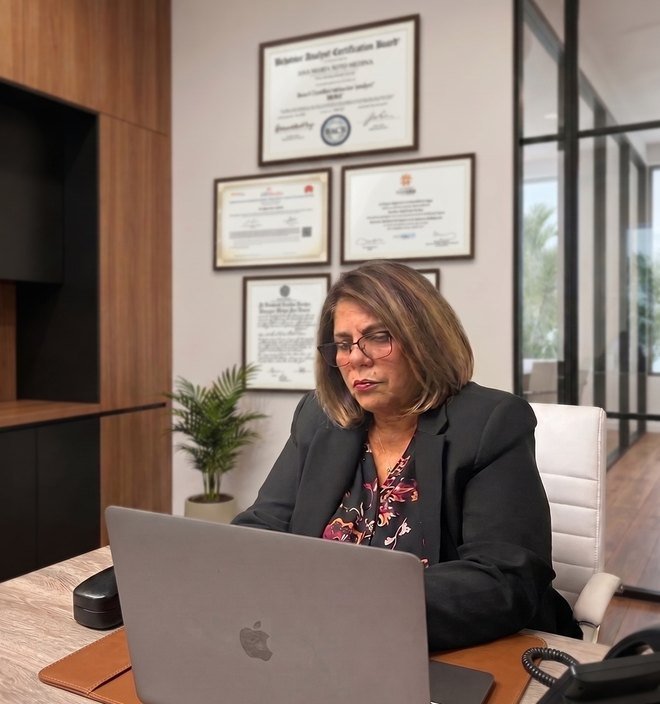Ana Soto at her desk at A&S Good Behavior